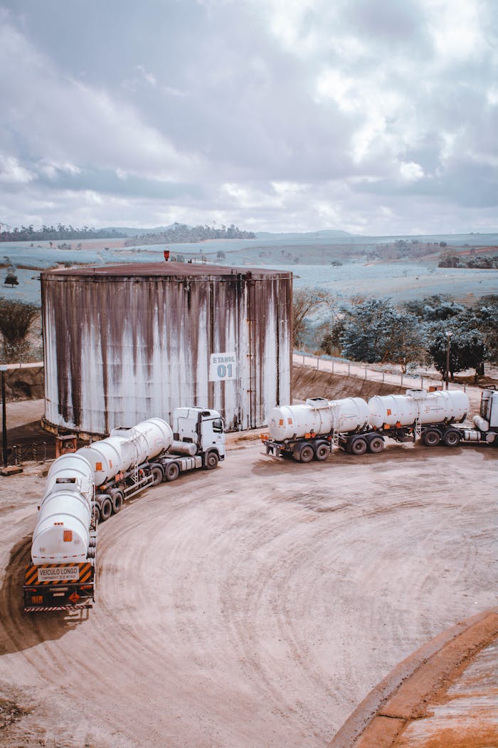 Aerial view of industrial trucks near a large silo in Serra dos Aimorés, Brazil.